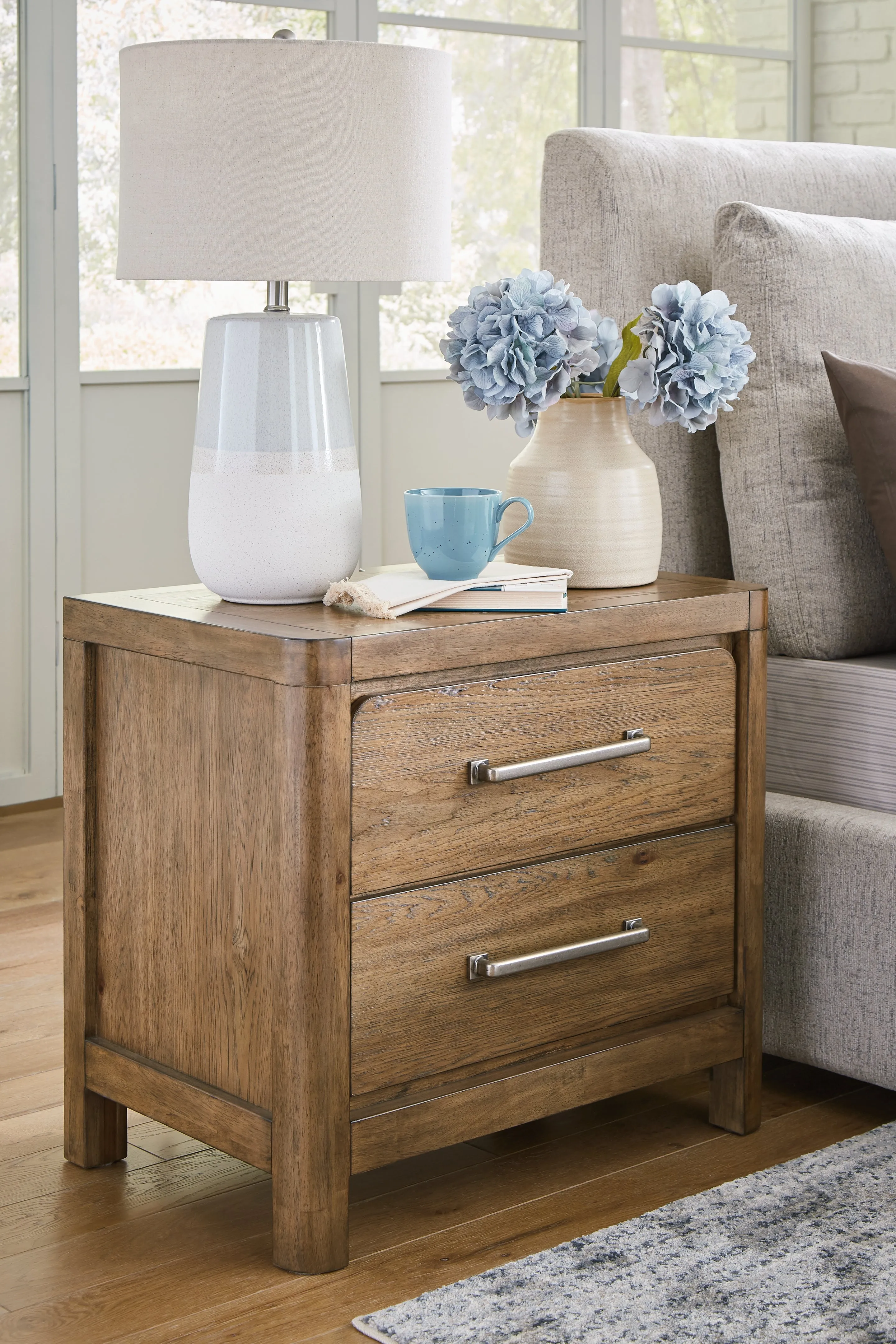 Cabalynn California King Panel Bed with Storage with Mirrored Dresser and 2 Nightstands in Light Brown